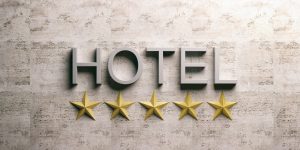 Five stars hotel sign on a marble background. 3d illustration