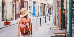woman tourist on the street, summer fashion style, travel to Europe